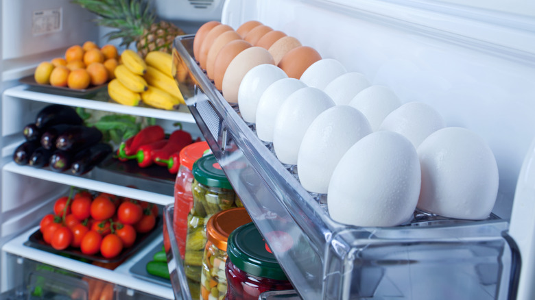 Eggs on rack in refrigerator door