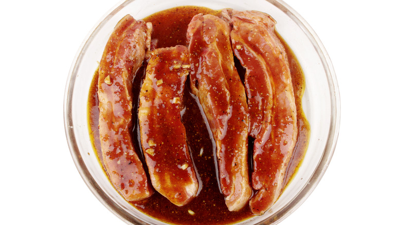 Meat soaking in marinade