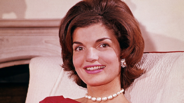 Jackie Kennedy smiling in home.