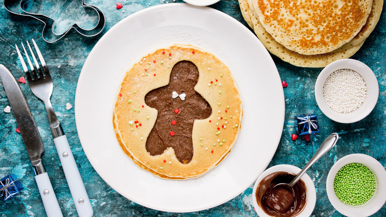 pancake with a gingerbread man and toppings