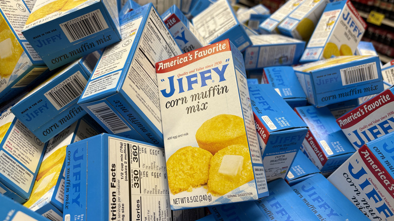 A pile of Jiffy corn muffin mix boxes