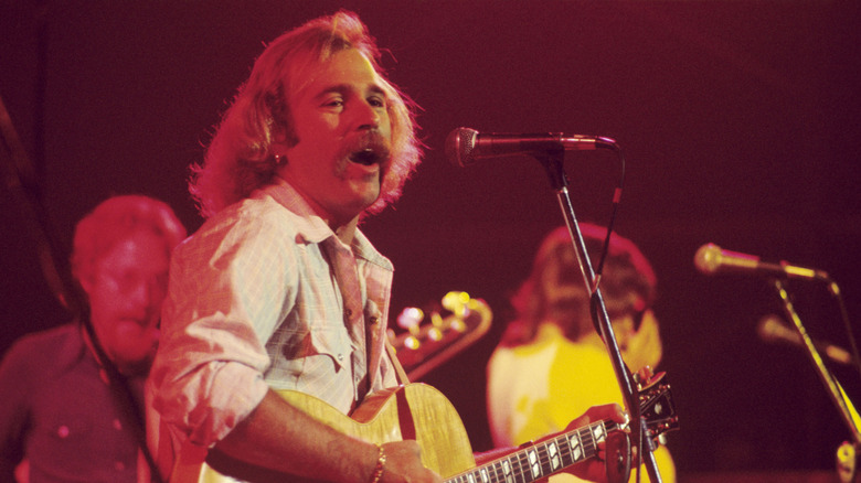 Jimmy Buffet on stage with guitar