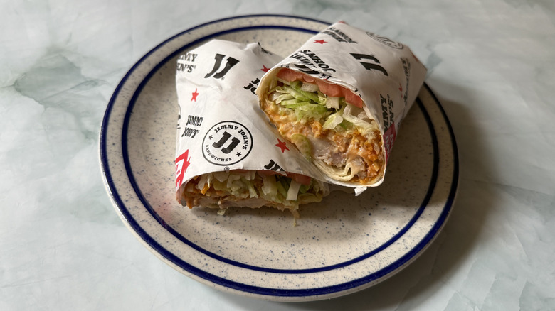Jimmy John's Buffalo Ranch Chicken Wrap cut in half on a plate