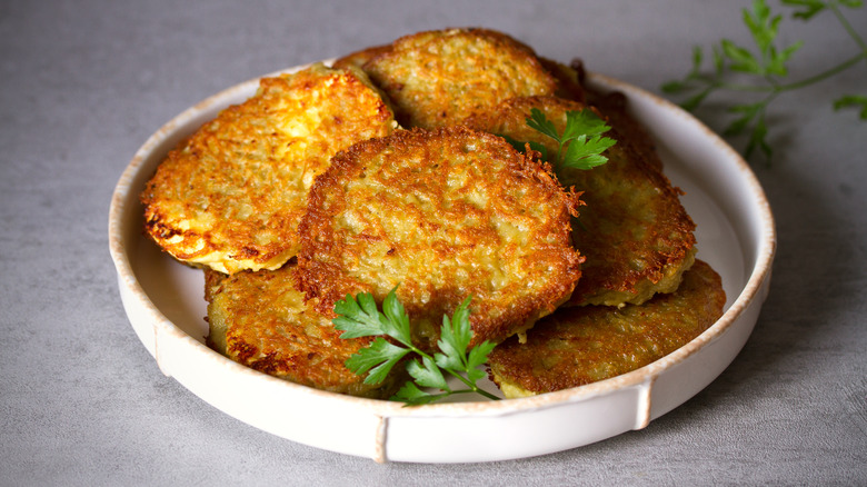 Latkes served with parsley on plate