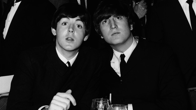 Close up of John Lennon and Paul McCartney sitting