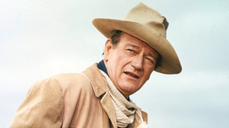 John Wayne in cowboy hat looking in distance