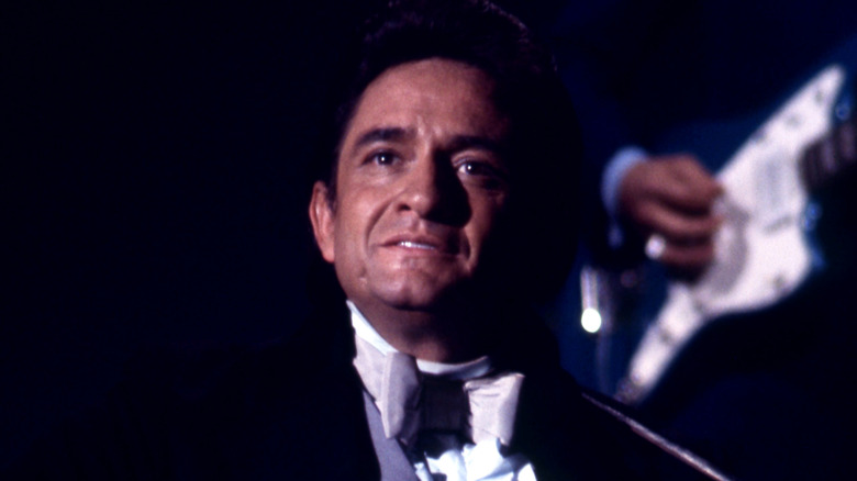 Johnny Cash on stage smiling