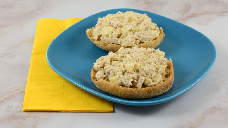 Open-faced tuna sandwich on split English muffin