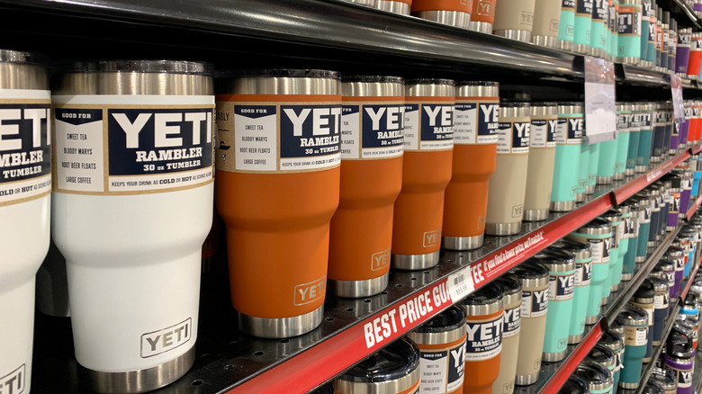Rows of colorful Yeti tumblers on a store shelf