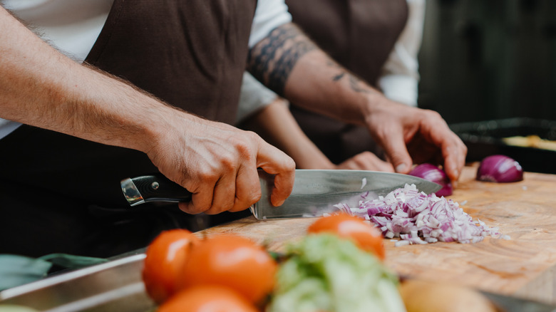 Fine dicing red onions