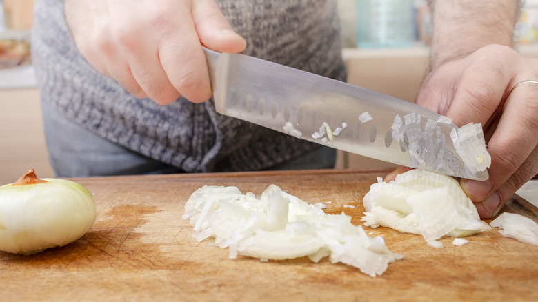 Chopping onions with a santoku knife