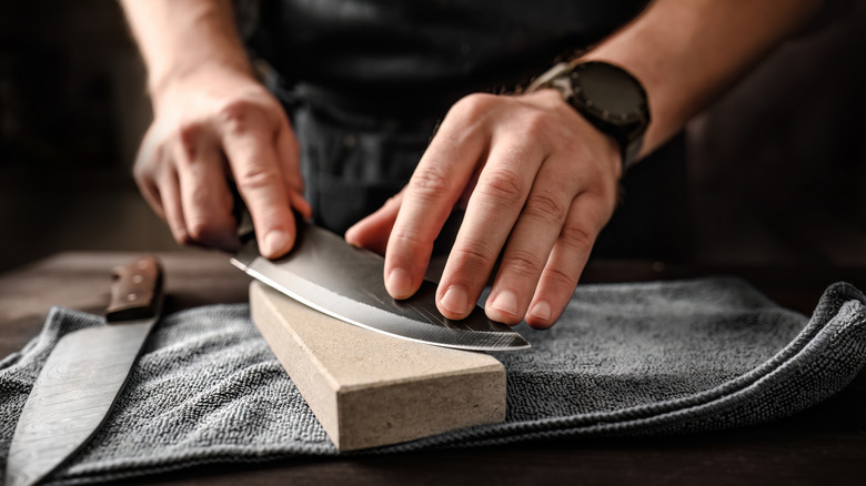 Sharpening a knife on a whetstone
