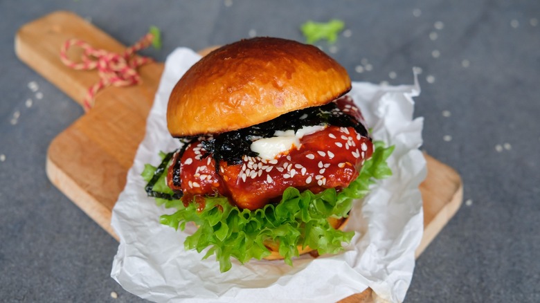 Korean burger smothered in gochujang sauce