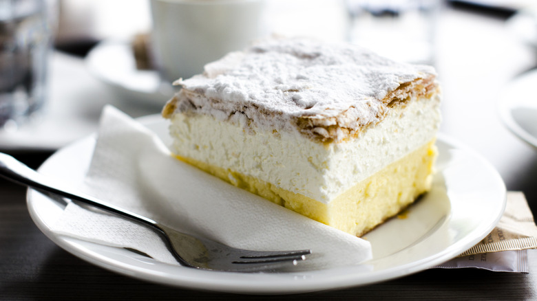 Kremsnita on a plate with a fork