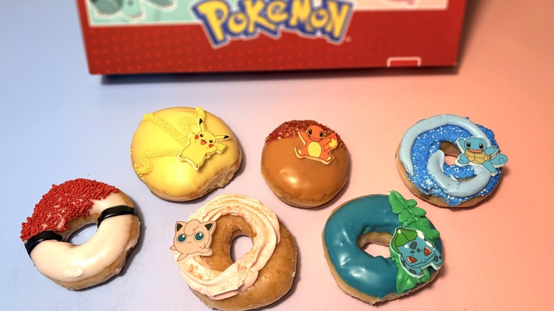 variety of pokemon themed krispy kreme donuts in front of box