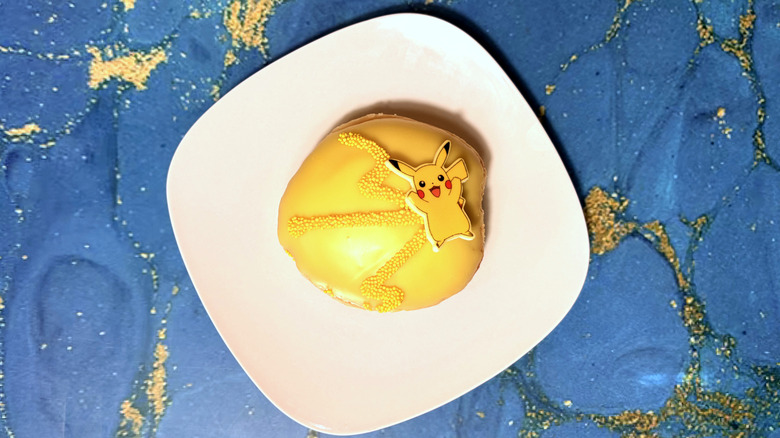 pikachu themed shell doughnut on plate