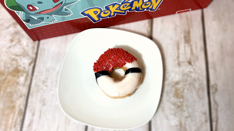 poke ball themed doughnut on plate