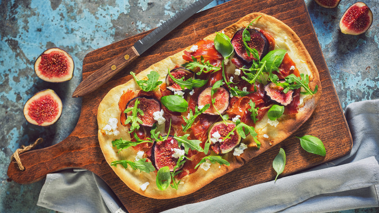 Flatbread pizza on wooden board