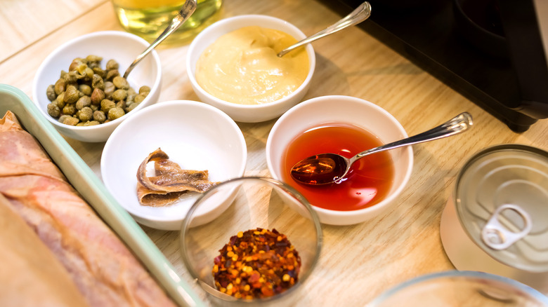 Anchovy sauce ingredients in bowls