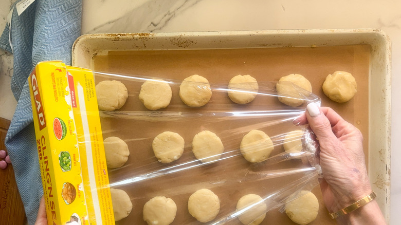 hand covering sheet pan