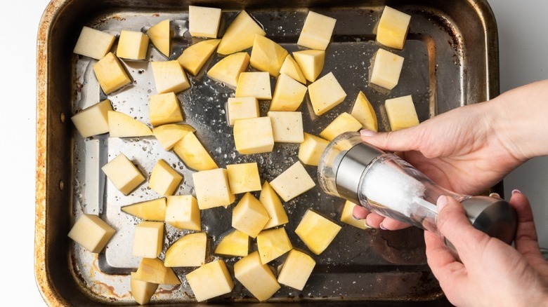 oiled rutabaga cubes in baking dish