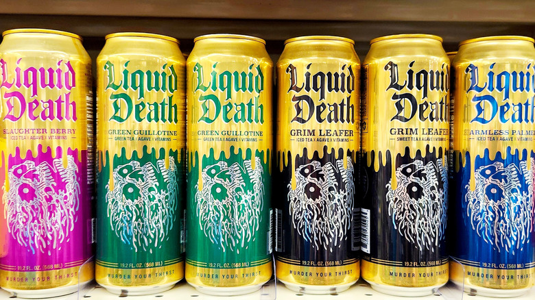 Cans of Liquid Death in various flavors on store shelf