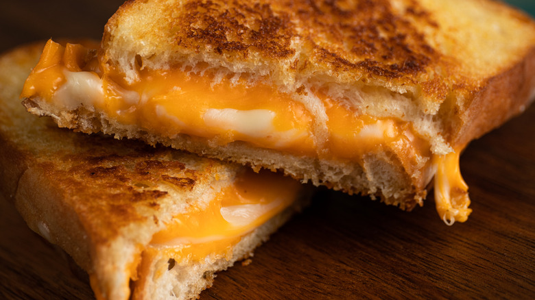 Close up of a gooey golden brown grilled cheese