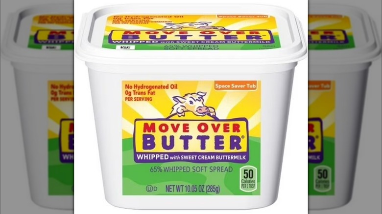 A tub of Move Over Butter Table Spread on a white background