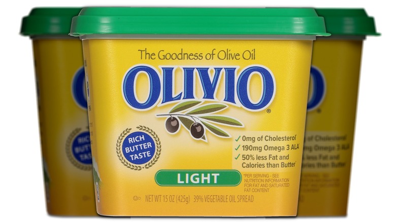 A tub of Olivio Light Spread on a white background