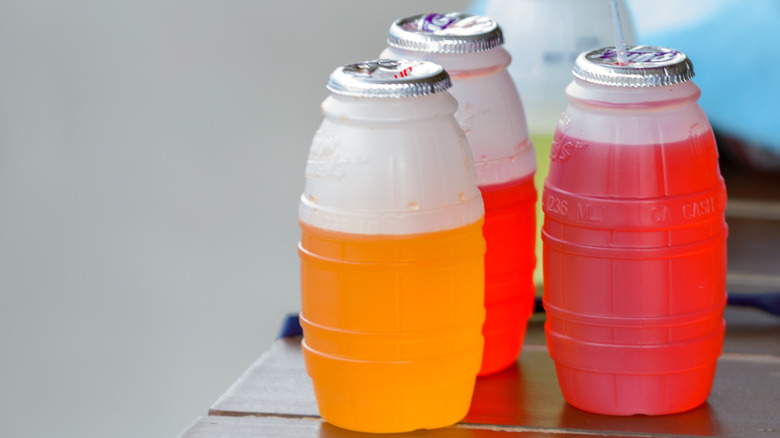 Orange and red juice barrels