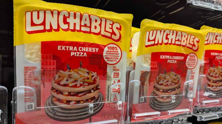 Extra cheesy pizza Lunchables on sale in a supermarket refrigerator