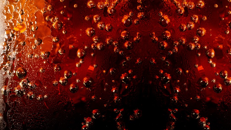 Bubbles forming in Coca-Cola soda