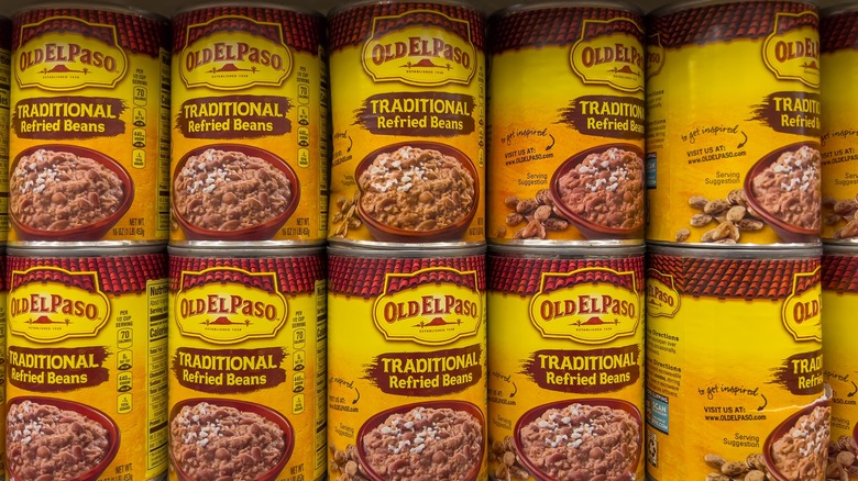 Canned refried beans on shelf