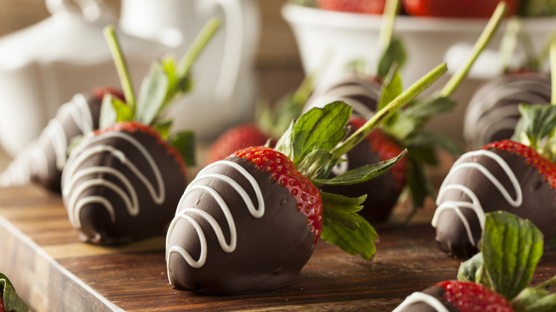 Chocolate covered strawberries with a white drizzle
