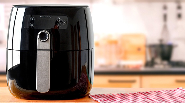 An air fryer on a kitchen counter 