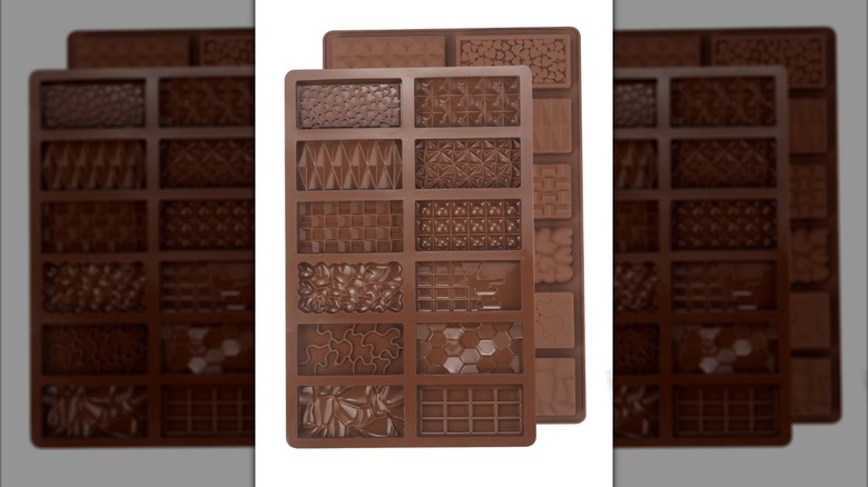 A brown mini chocolate bar mold with patterns on the rectangles