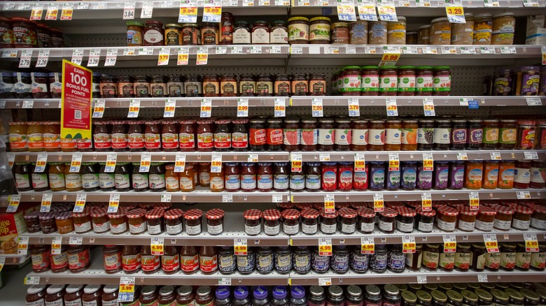 Jars of jelly on a grocery store's shelves