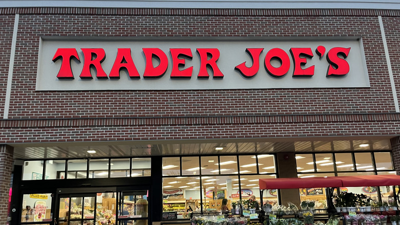 The exterior of a Trader Joe's grocery store location with brown and white brick