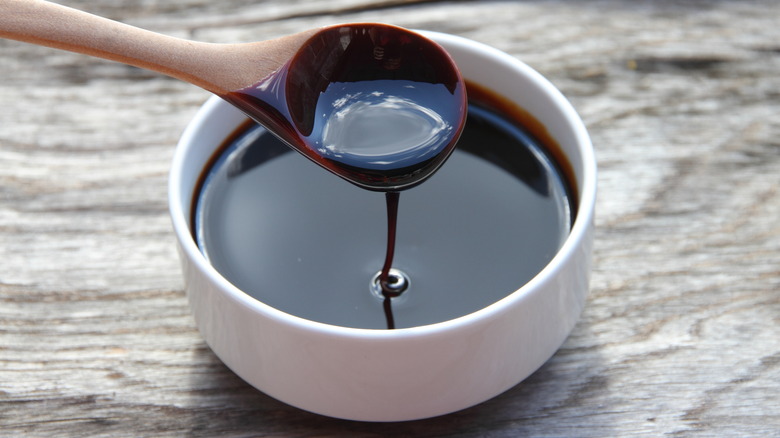 Molasses dripping off a spoon