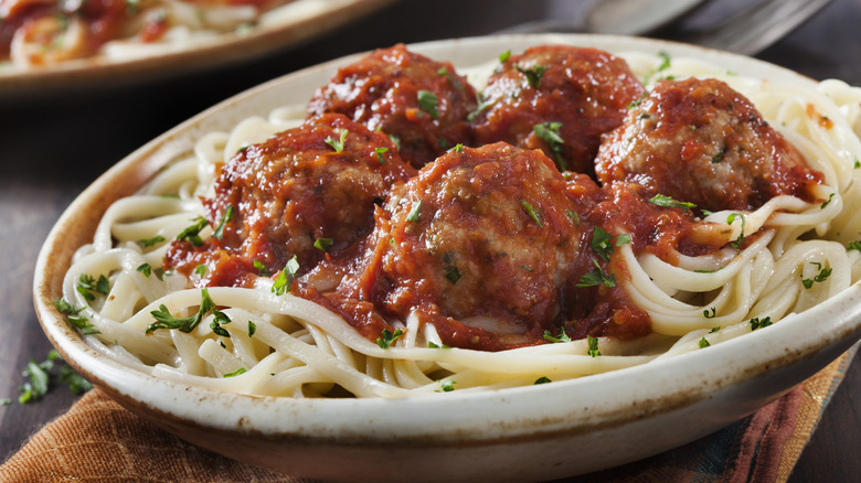 Meatballs in marinara on top of spaghetti