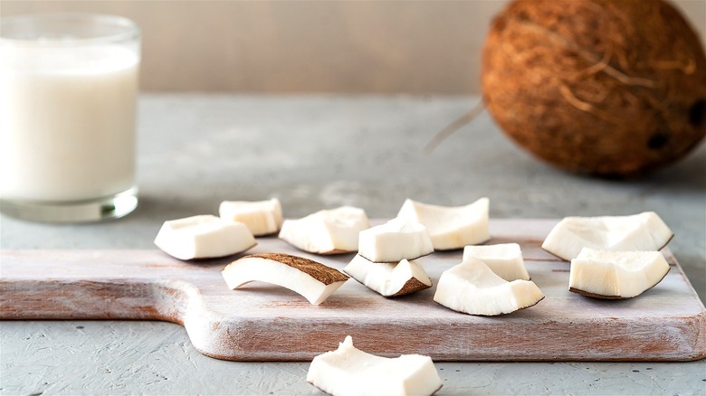 Coconut pieces on cutting board 