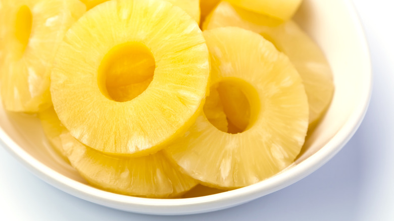 Close up of pineapple slices arranged in a white bowl