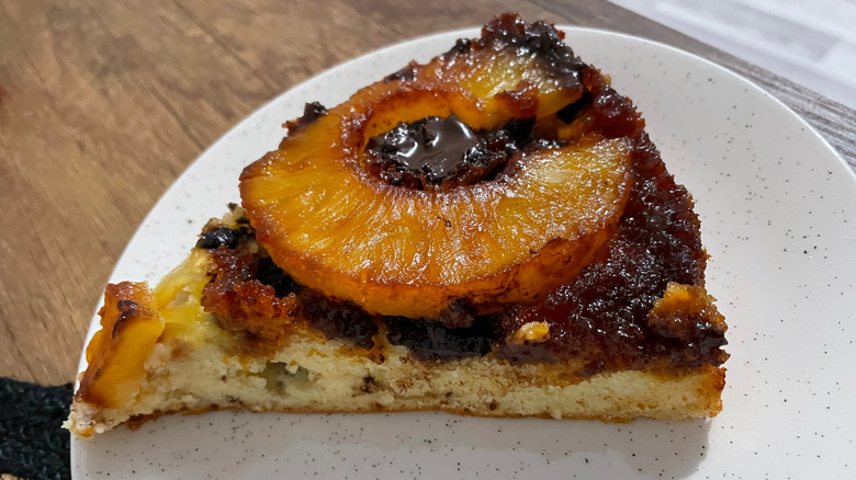 A piece of pineapple upside down cake that has been overcooked