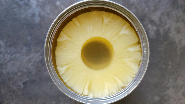 Close up of the opened top of a can of pineapple slices