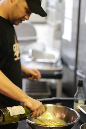 Chef Scott Smith adding White Wine