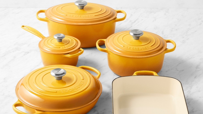 Marilyn Monroe's Elysée Yellow Le Creuset cookware set with white background