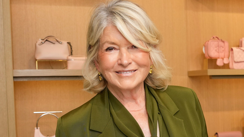 Closeup of Martha Stewart in a store with a green outfit