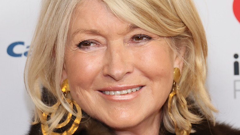 Martha Stewart wearing gold earrings