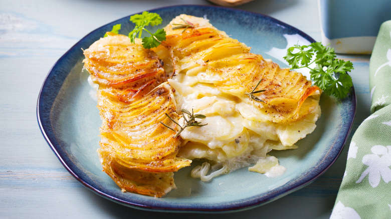 Blue plate of scalloped potatoes