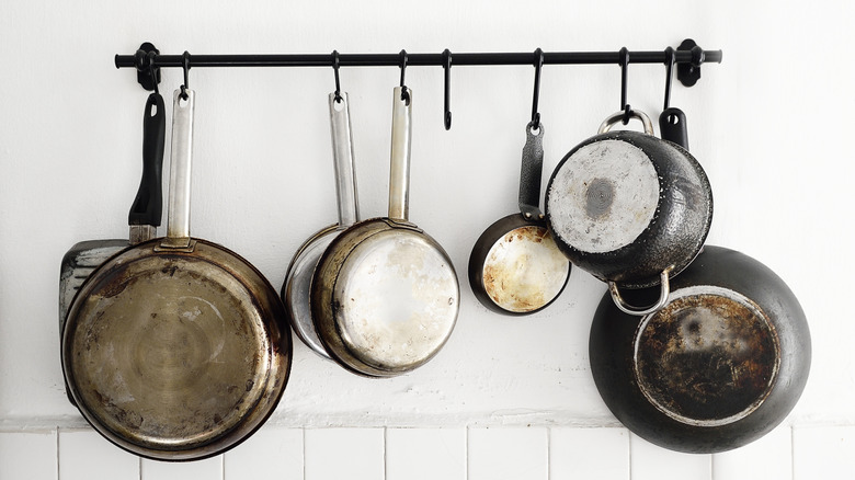 Pots and pans hanging from a rack